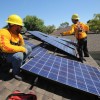 Sullivan Solar Power employees install solar panels on the roof of a San Diego home. 